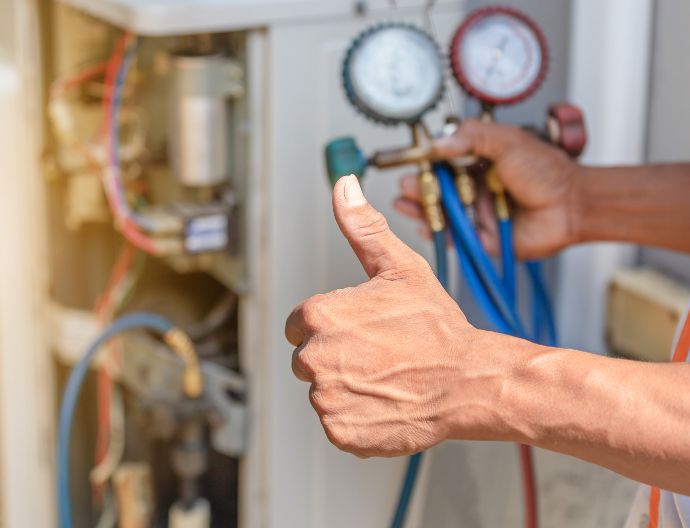 Technician checking a heat pump